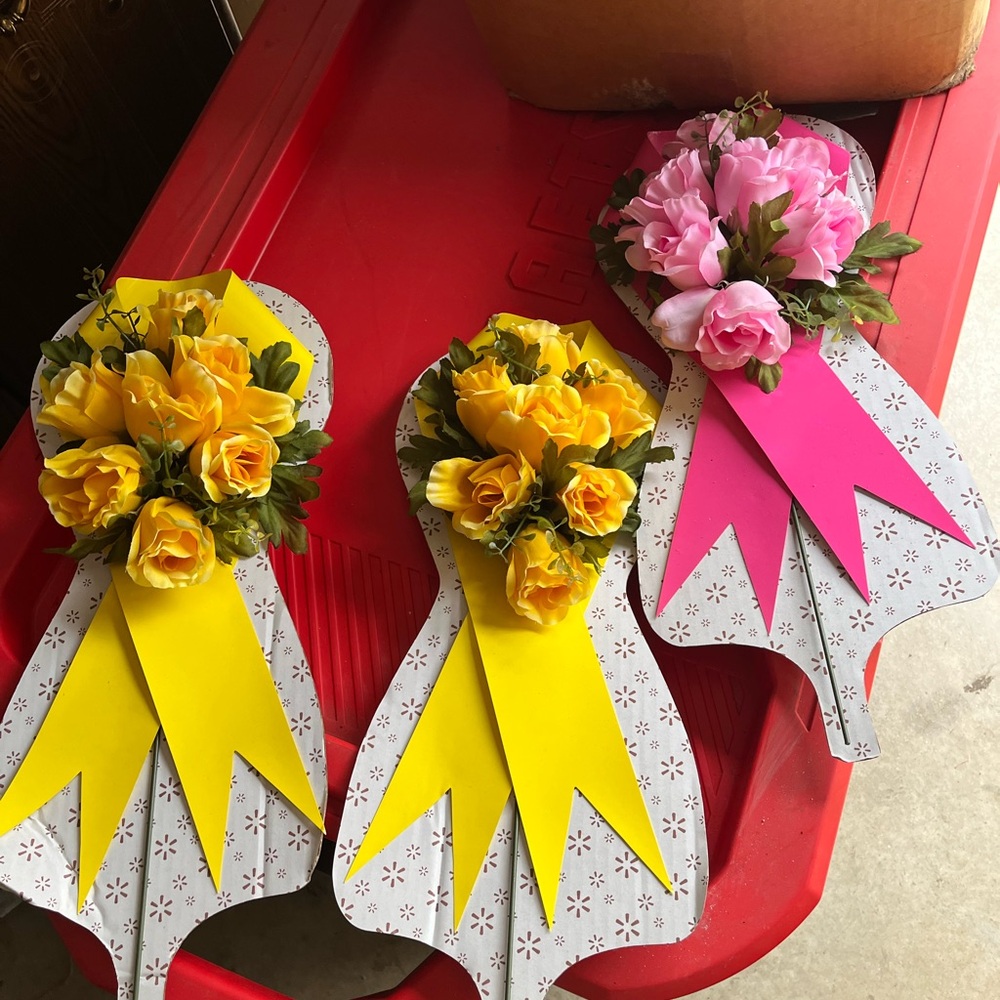 Yellow and Pink Floral Arrangements on Metal Rod